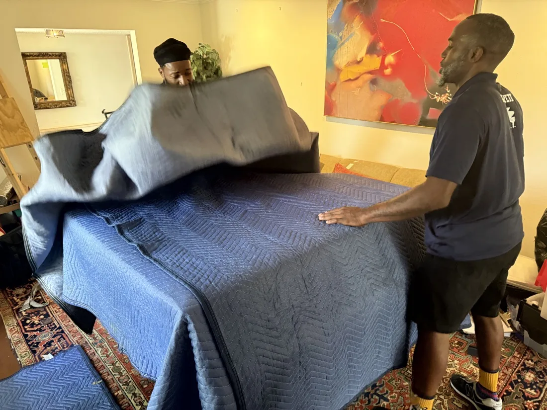 Maestro crew carefully handling furniture